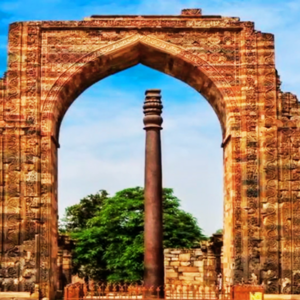 Blog post header image featuring the ancient Iron Pillar at the Qutb Minar complex in New Delhi