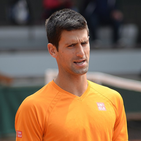 Novak Djokovic at the Italian Open, appearing concerned and off-balance during a match